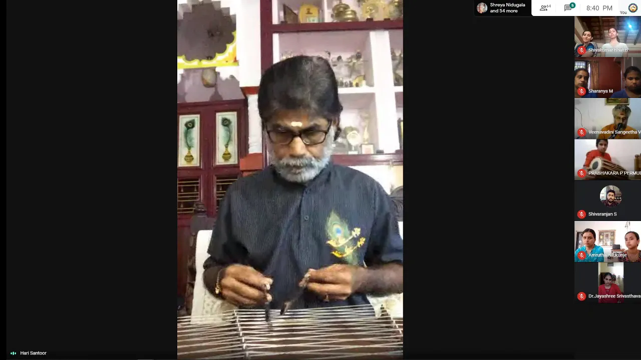 A television screen relaying the fourth Samyoga online programme, a young vocalist singing in the main window with the audience’s video tiles alongside.